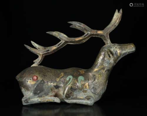 A PAINTED POTTERY DEER