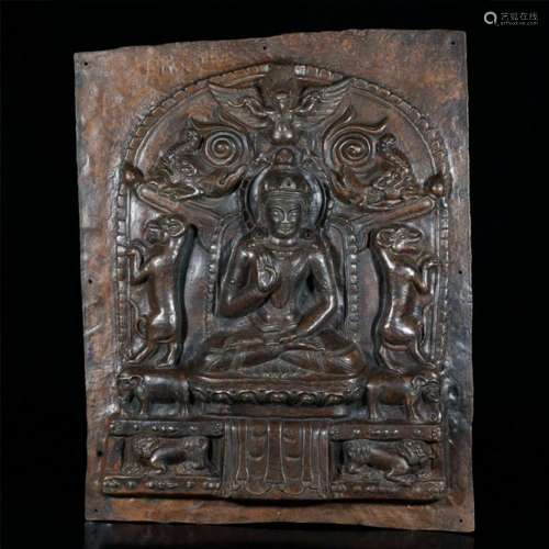 A CARVED BRONZE PANEL