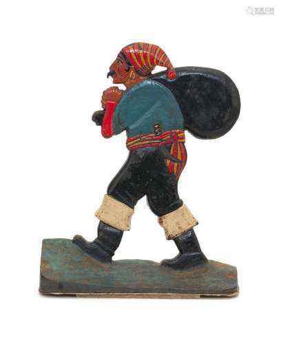 CAST IRON PIRATE DOORSTOP Polychrome pirate holding a treasure sack on a green rockery base. Height 12