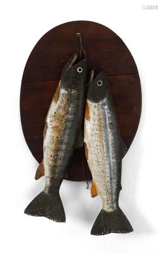 PAIR OF CARVED AND PAINTED WOODEN TROUT Mounted on a walnut backboard. Length of trout 14.5