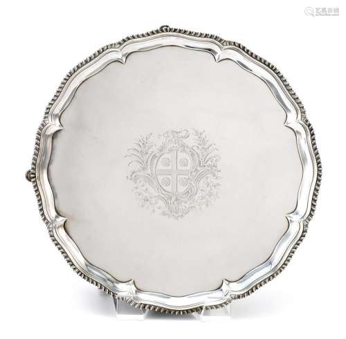GEORGE III STERLING SILVER SALVER Richard Rugg I, maker. Central engraved coat of arms. Lobed border and gadrooned rim. Four spade f...