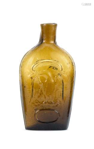 STODDARD BLOWN-MOLDED GLASS FLASK In amber. Both sides with molded eagle and Liberty shield decoration. Height 6.25