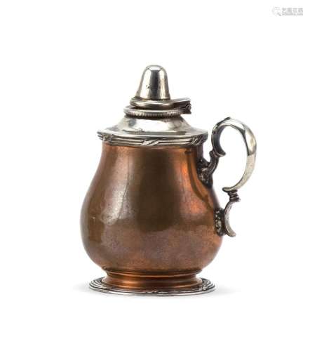 TIFFANY & CO. MIXED METAL SPIRIT LAMP Copper tankard-form body and sterling silver wick lid, cover, handle and foot rim. Height 3.25