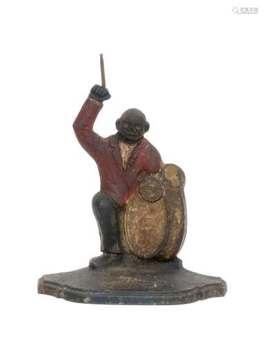 SPENCER MANUFACTURING CO. CAST IRON DRUMMER DOORSTOP Black drummer wearing a red jacket on a stepped base. Height 7.75