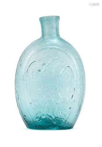 BLOWN-MOLDED GLASS FLASK In light blue. Obverse with molded cornucopia decoration. Reverse with molded eagle and Liberty shield deco...