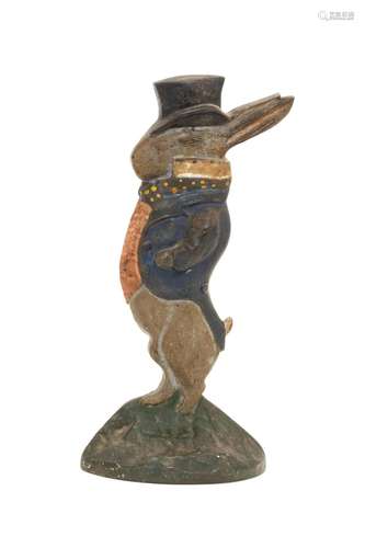 NATIONAL FOUNDRY CAST IRON WELL-DRESSED RABBIT DOORSTOP Polychrome rabbit standing on a green base. Height 10