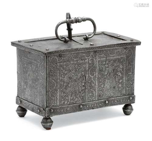 STEEL VALUABLES BOX Engraved with floral and foliate designs and rectangular figural panels. Lid with bail handle on exterior and el...