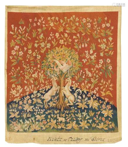 NEEDLEWORK TAPESTRY Depicts unicorns in a garden setting with pastel flower blossoms on a rust red ground and green hillside. Marked...