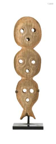 INUIT CARVED WHALEBONE ORNAMENT Carved in the form of three faces. Height 8