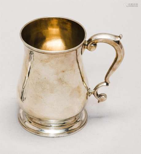 GEORGE II STERLING SILVER MUG Samuel Wood, maker. Balustroid form with spreading molded foot and scrolled handle. Height 4.75