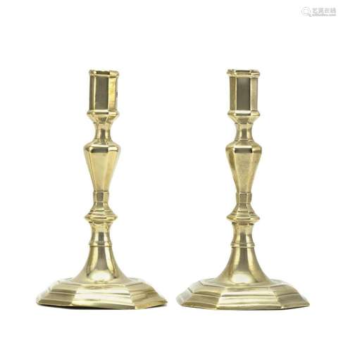 PAIR OF QUEEN ANNE BRASS CANDLESTICKS In octagonal form. Heights 8.25