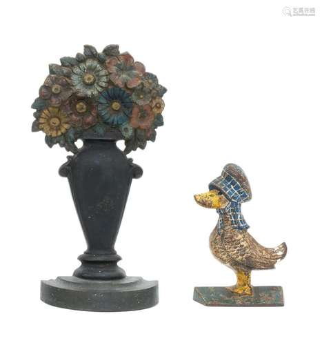 TWO CAST IRON DOORSTOPS 1) Bradley & Hubbard doorstop in the form of a vase of flowers. Height 11.5