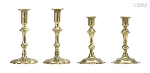 TWO PAIRS OF QUEEN ANNE BRASS CANDLESTICKS Both pairs with modified lobed feet. Heights 6.75