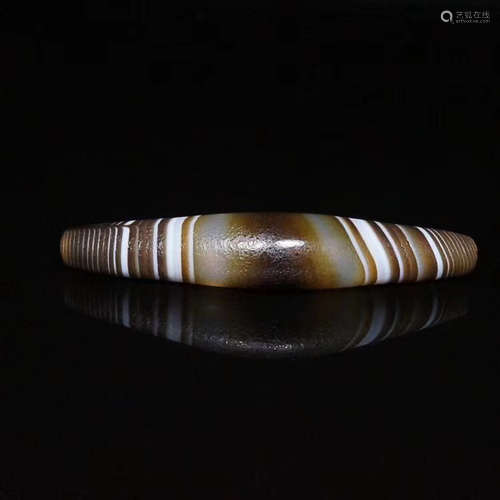 A TIBETAN WIRE WRAPPING PATTERN DZI BEAD