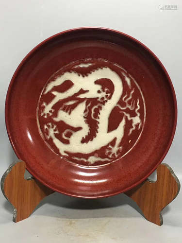 A DRAGON PATTERN RED GLAZED PLATE