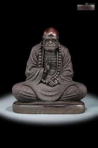 A BODHIDHARMA DESIGN PURPLE BRONZE FIGURE