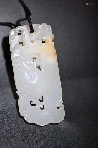 18-19TH CENTURY, A BEAST PATTERN HETIAN JADE PENDANT, LATE QING DYNASTY