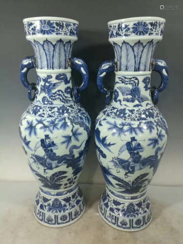 A PAIR OF BLUE AND WHITE DOUBLE ELEPHANT SHAPED EAR VASES