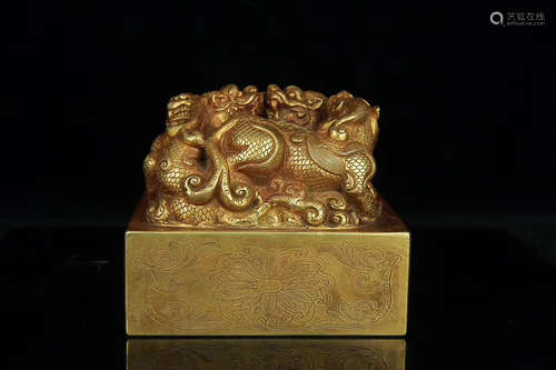 A BEAST DESIGN GILT BRONZE STAMP