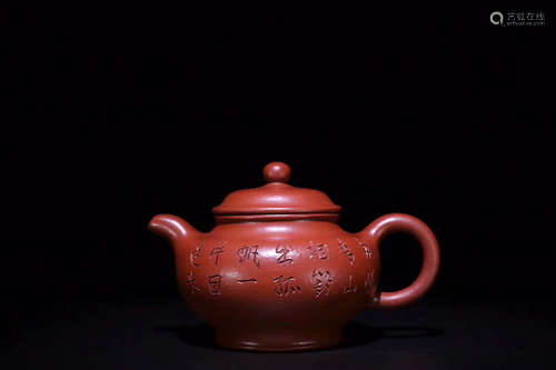 A PURPLE CLAY TEAPOT