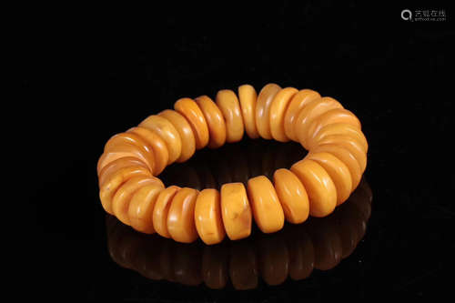 AN OLD BEESWAX BRACELET