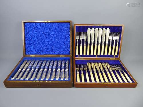 A Canteen of Twelve Silver Plated Knives and Forks with engraved blades