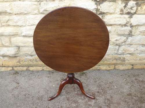 An Antique Circular Mahogany Tilt-Top Table