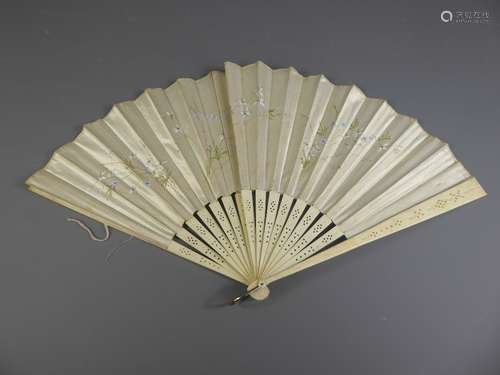 An Antique Ladies Carved Bone and Hand-Painted Cream Silk Fan