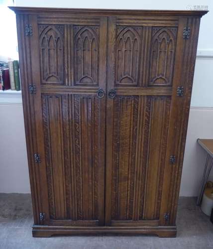 An Oak Gothic Arts & Crafts Style Wardrobe