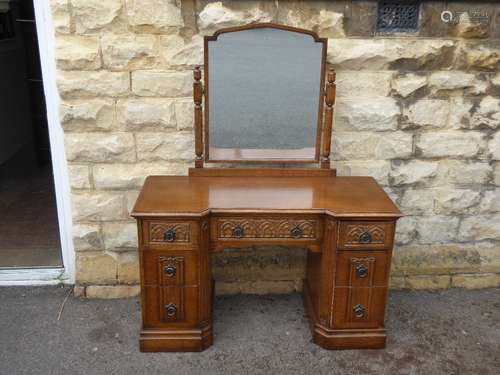 An Oak Gothic Arts & Crafts Style Mirrored Knee-hole Dressing Table