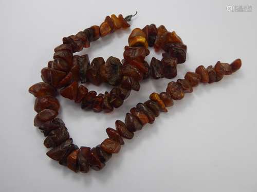 An Antique Unpolished Graduated Amber Necklace