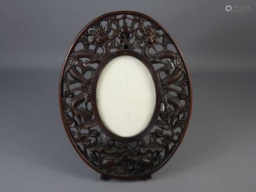 A Chinese Rosewood Oval Easel Frame