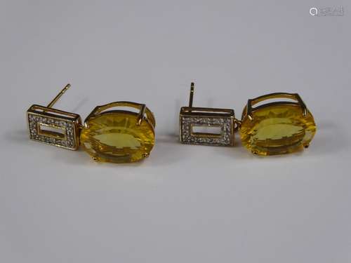 A Pair of 9ct Gold Yellow Stone and Diamond Earrings