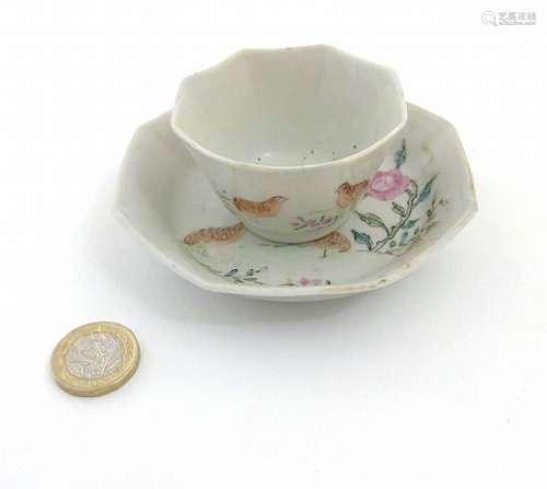 A Chinese Famille Rose octagonal cup and saucer depicting partridges amidst