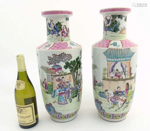 A pair of Famille Rose Rouleau vases, each depicting a continuous scene of