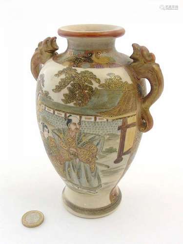 A Japanese Satsuma vase with dragon formed handles, having two panels depic