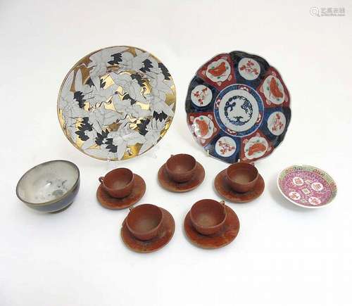 A quantity of Oriental ceramics comprising a Japanese '100 Crane' plate dep