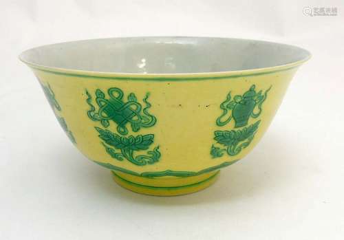 A Chinese bowl decorated with green auspicious items above a lotus flower h
