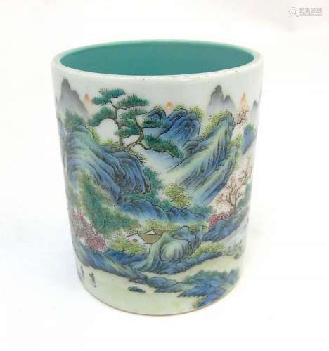 A Chinese famille rose brush pot painted in enamels depicting a continuous