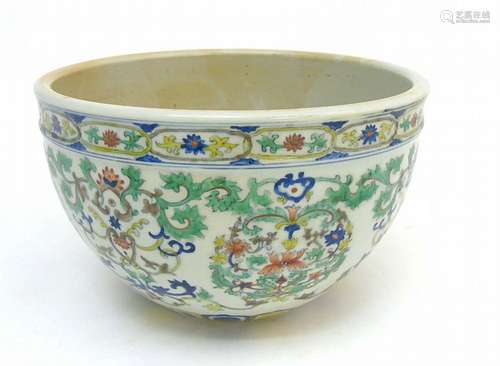 A Chinese Doucai jardiniere, with lotus scroll decoration across body, peta