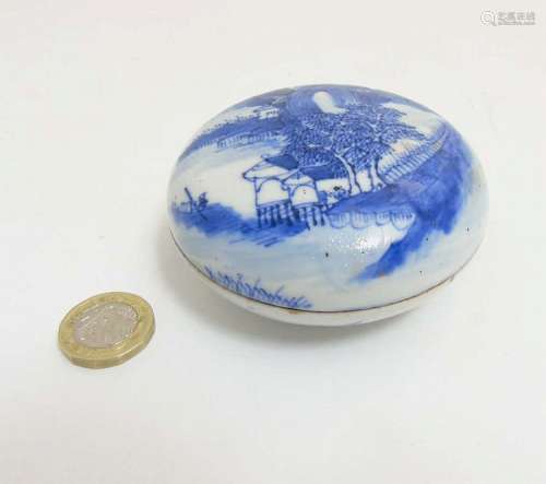 A Chinese circular blue and white lidded pot containing red ink paste, blue