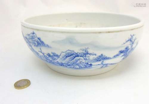 A Chinese blue and white bowl decorated in an underglaze blue continuous la