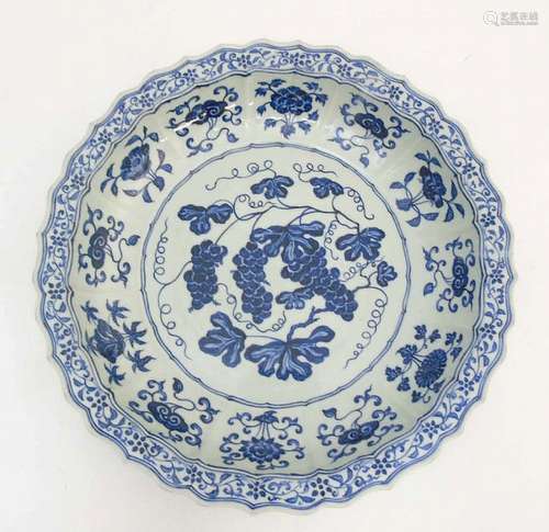 A Chinese blue and white 'Grape' dish / charger: A large Chinese charger wi