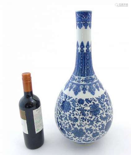 A Chinese blue and white pear shaped vase with bulbous body and tall cylind