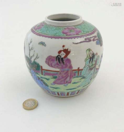 A Chinese Famille Verte ginger jar decorated in enamels of green, pink, pur