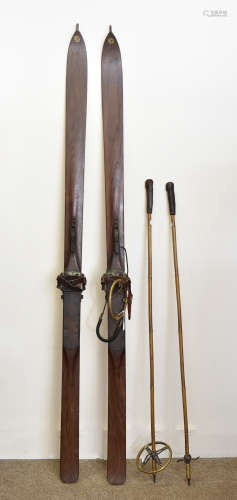 A pair of Telemark vintage skis, retailed through 'The Sportsman Emporium Glasgow' with poles 196 cm