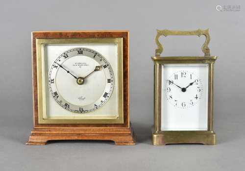A brass carriage time piece, an art deco burr walnut time piece mantle clock on bracket feet 14cm