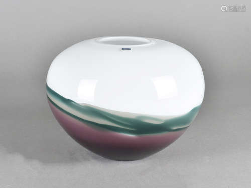 A Caithness globular glass vase, in mauve, green and white, 20 cm diameter