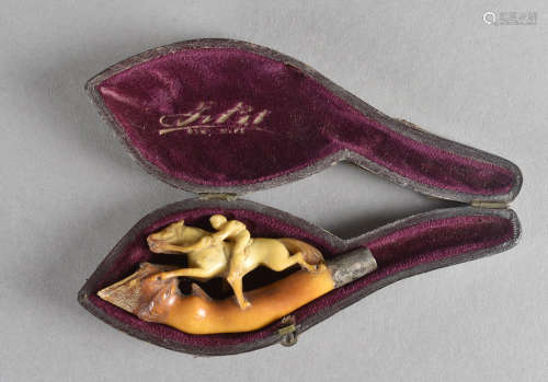A cased meerschaum cheroot holder, lacking mouth piece modelled as a horse and jockey surmounted