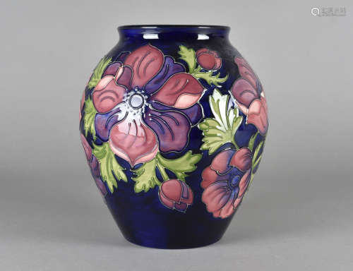 A large Moorcroft ovoid pottery vase, tube-lined decoration, Anemone on blue ground, printed and